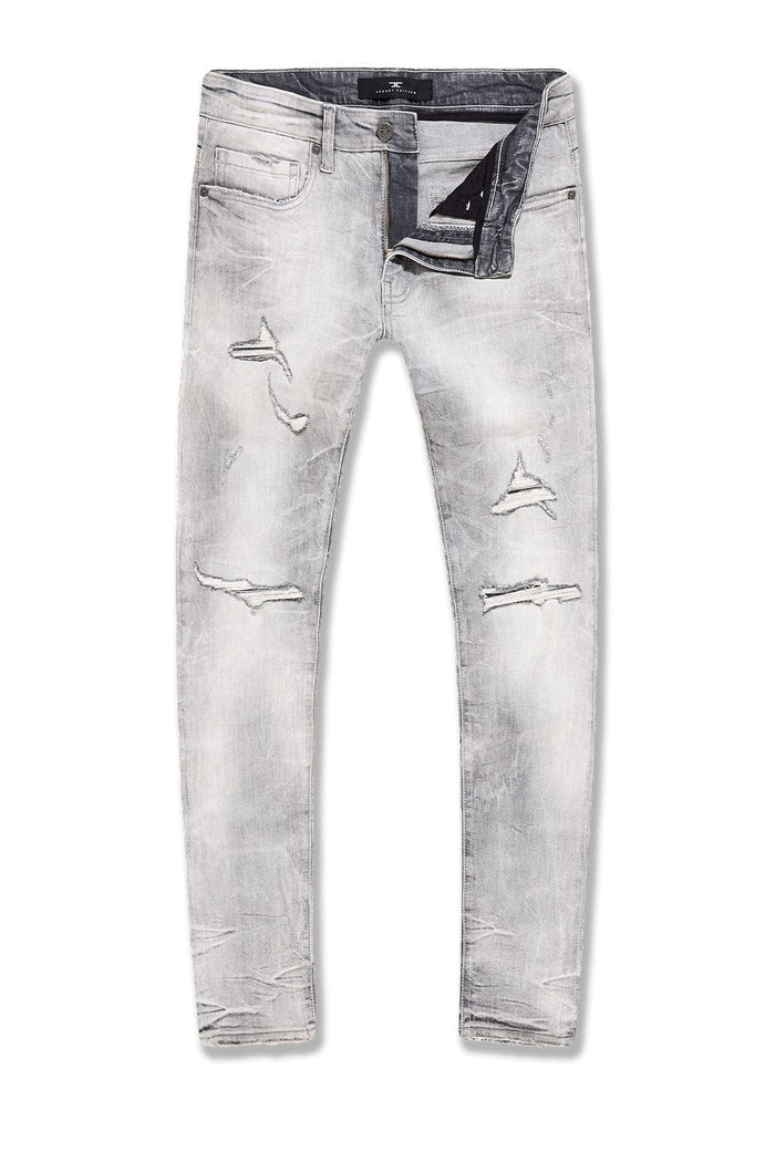 Sean Slim Taper Fit Jeans with super-stretch fabric, rip-and-repair detailing, and unique distressing