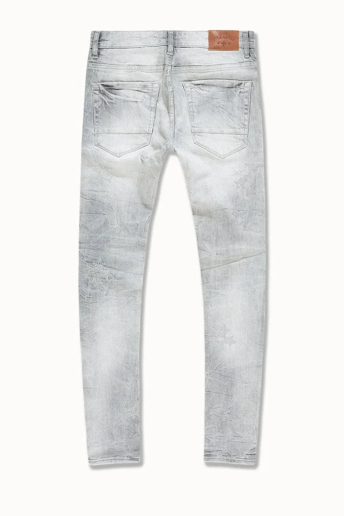 Crafted for a modern fit, the Men's Slim Taper Limelight Denim Pant by Jordan Craig offers a sleek silhouette that narrows from the thigh to the ankle. Made with durable denim, these pants balance style and comfort, ensuring they hold shape while allowing ease of movement. Ideal for those seeking a refined yet casual look, they pair well with both streetwear and smart-casual ensembles.