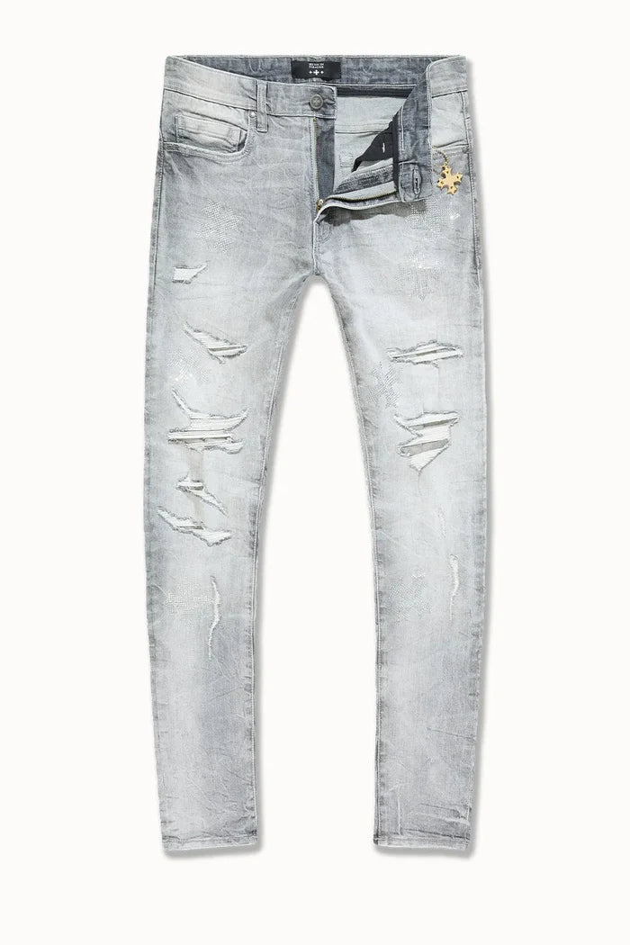 Crafted for a modern fit, the Men's Slim Taper Limelight Denim Pant by Jordan Craig offers a sleek silhouette that narrows from the thigh to the ankle. Made with durable denim, these pants balance style and comfort, ensuring they hold shape while allowing ease of movement. Ideal for those seeking a refined yet casual look, they pair well with both streetwear and smart-casual ensembles.