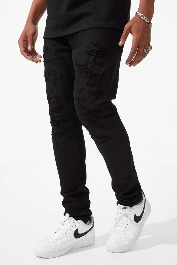  Slim taper fit super stretch jeans with rip-and-repair styling, fused shreds, and vintage distressing