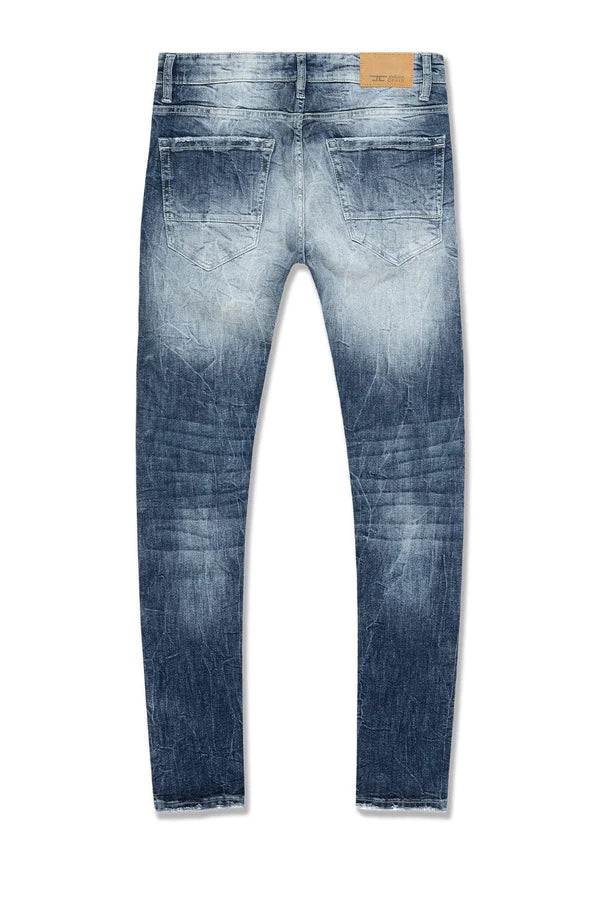  Slim taper fit super stretch jeans with rip-and-repair styling, fused shreds, and vintage distressing