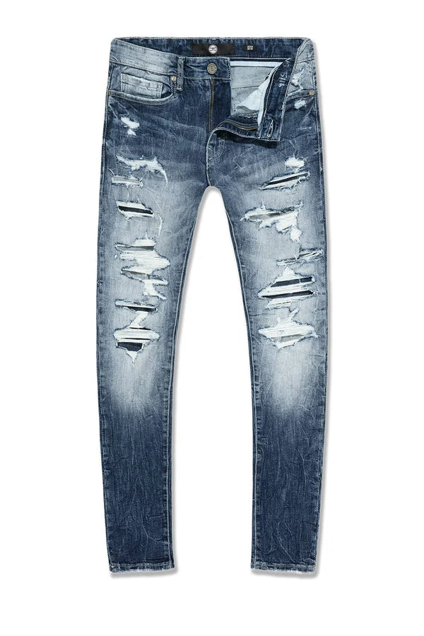  Slim taper fit super stretch jeans with rip-and-repair styling, fused shreds, and vintage distressing