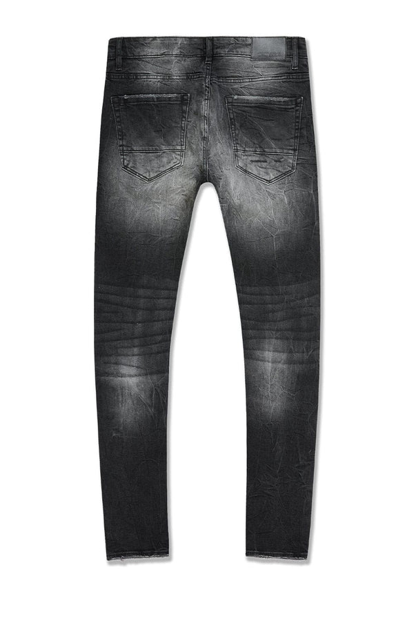  Slim taper fit super stretch jeans with rip-and-repair styling, fused shreds, and vintage distressing