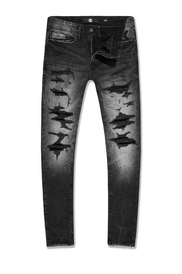  Slim taper fit super stretch jeans with rip-and-repair styling, fused shreds, and vintage distressing