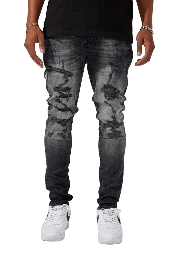 Jordan Craig Newport denim jeans in slim taper fit with distressed rip-and-repair details, 3D wrinkles, and modern stretch fabric