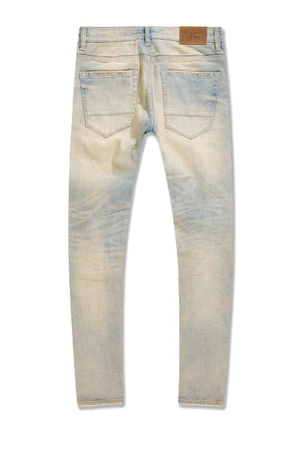 Jordan Craig Newport denim jeans in slim taper fit with distressed rip-and-repair details, 3D wrinkles, and modern stretch fabric