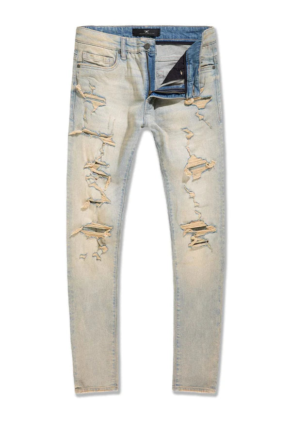 Jordan Craig Newport denim jeans in slim taper fit with distressed rip-and-repair details, 3D wrinkles, and modern stretch fabric