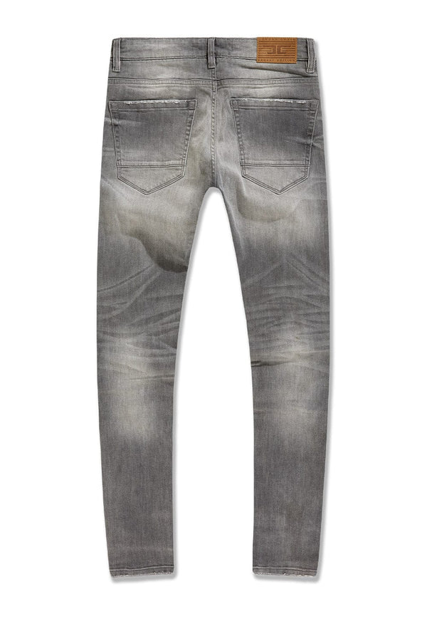 Jordan Craig Newport denim jeans in slim taper fit with distressed rip-and-repair details, 3D wrinkles, and modern stretch fabric