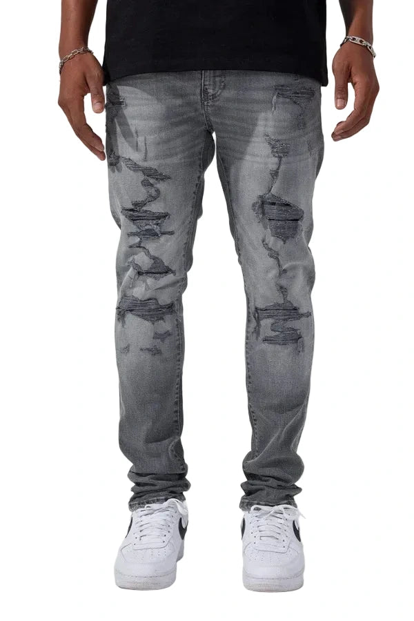 Jordan Craig Newport denim jeans in slim taper fit with distressed rip-and-repair details, 3D wrinkles, and modern stretch fabric