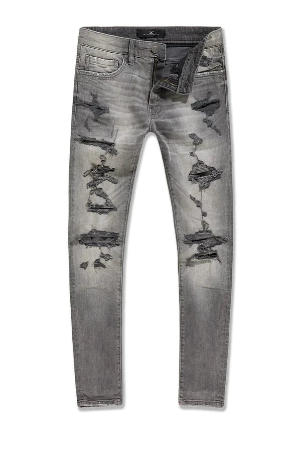 Jordan Craig Newport denim jeans in slim taper fit with distressed rip-and-repair details, 3D wrinkles, and modern stretch fabric