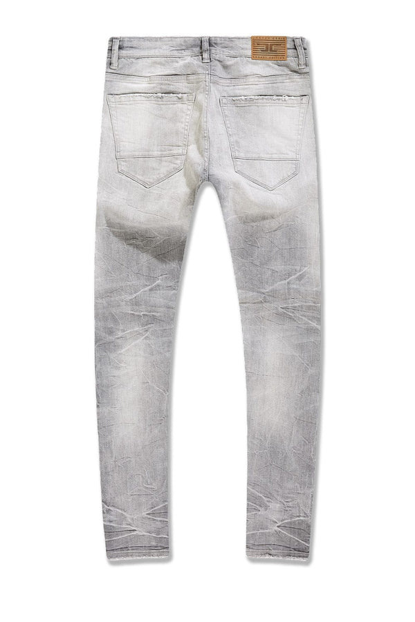 Slim taper fit jeans with 3D baked wrinkles, unique wash effect, and super stretch cotton Lycra fabric