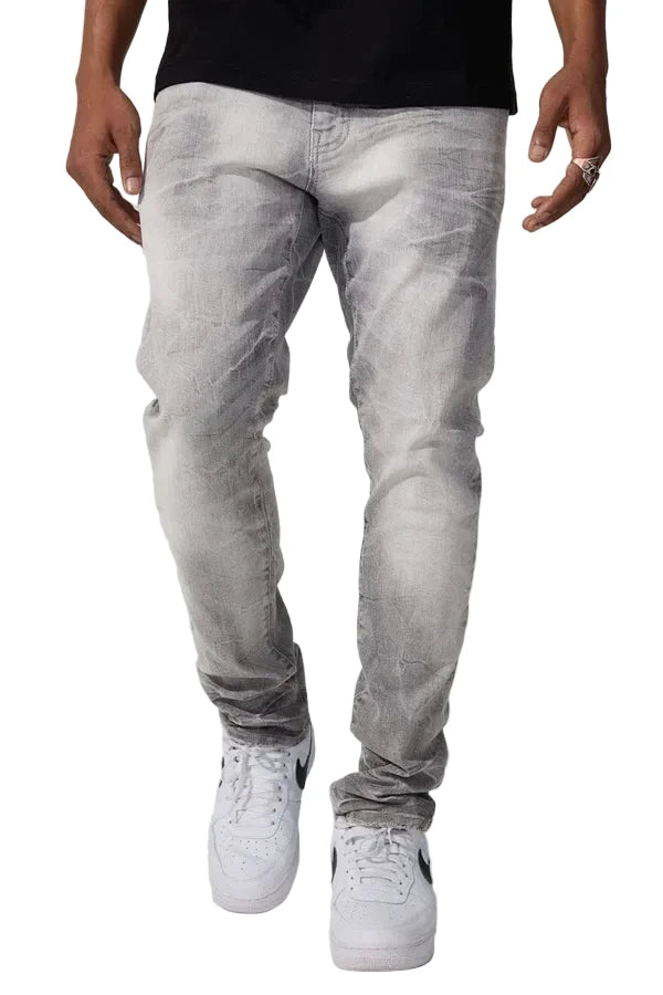 Slim taper fit jeans with 3D baked wrinkles, unique wash effect, and super stretch cotton Lycra fabric