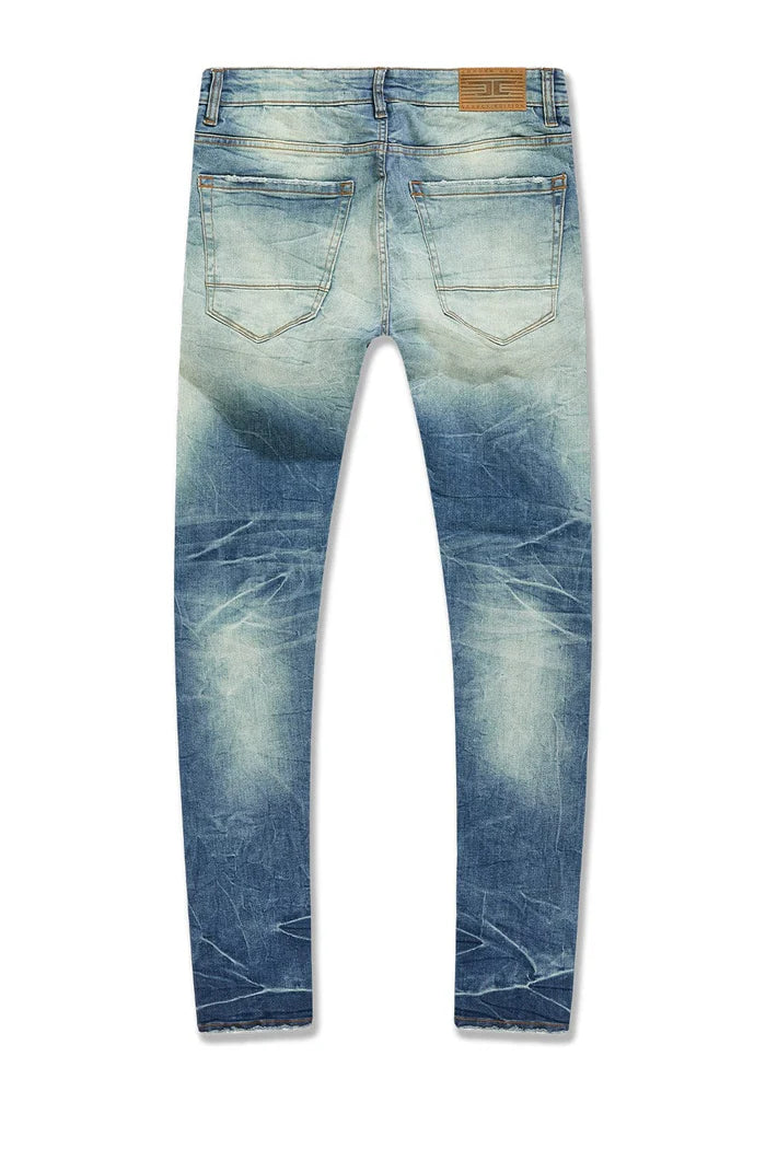 Slim taper fit jeans with 3D baked wrinkles, unique wash effect, and super stretch cotton Lycra fabric