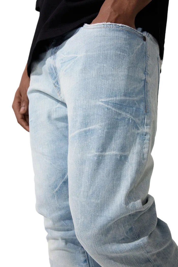 Slim taper fit jeans with 3D baked wrinkles, unique wash effect, and super stretch cotton Lycra fabric