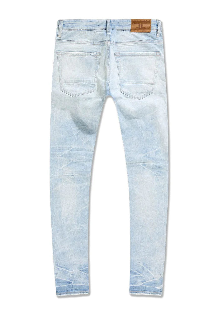 Slim taper fit jeans with 3D baked wrinkles, unique wash effect, and super stretch cotton Lycra fabric