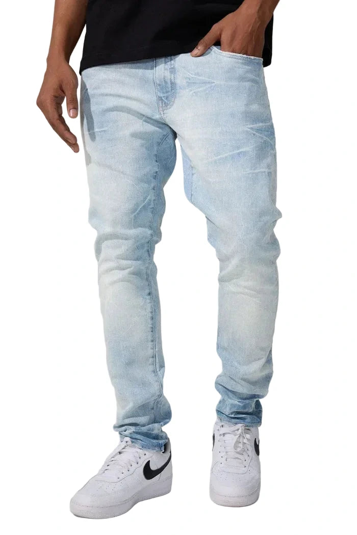 Slim taper fit jeans with 3D baked wrinkles, unique wash effect, and super stretch cotton Lycra fabric