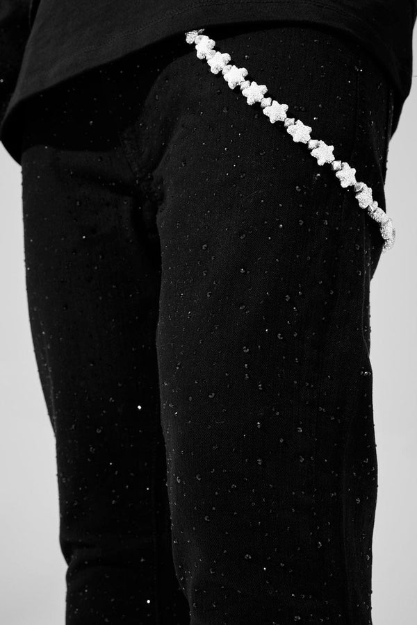 Jet black Magic City super skinny jeans with full rhinestone embellishments, 3D wrinkle details, and a tight stretch fit.