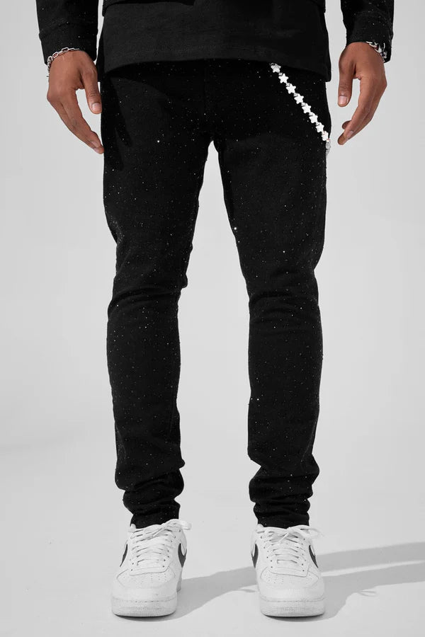 Jet black Magic City super skinny jeans with full rhinestone embellishments, 3D wrinkle details, and a tight stretch fit.
