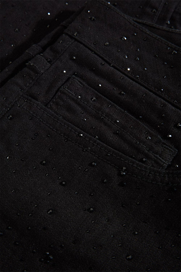 Jet black Magic City super skinny jeans with full rhinestone embellishments, 3D wrinkle details, and a tight stretch fit.