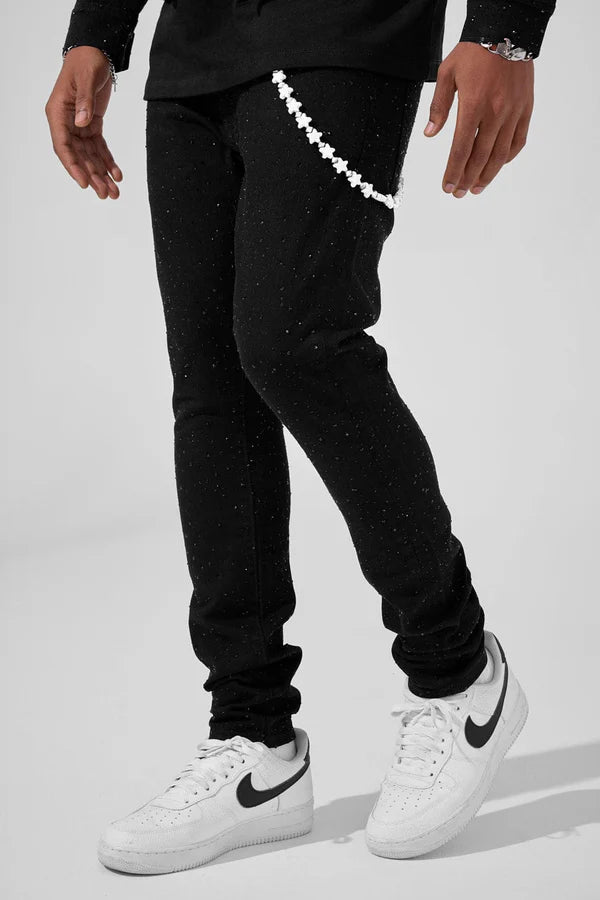 Jet black Magic City super skinny jeans with full rhinestone embellishments, 3D wrinkle details, and a tight stretch fit.