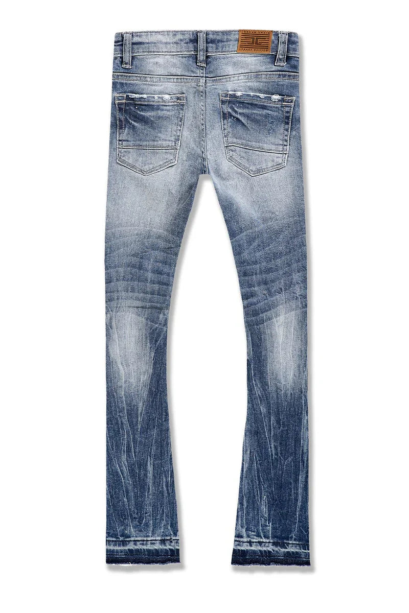 Extended-length flare denim pants with stacked leg, 3D baked wrinkles, and rip-and-repair detailing