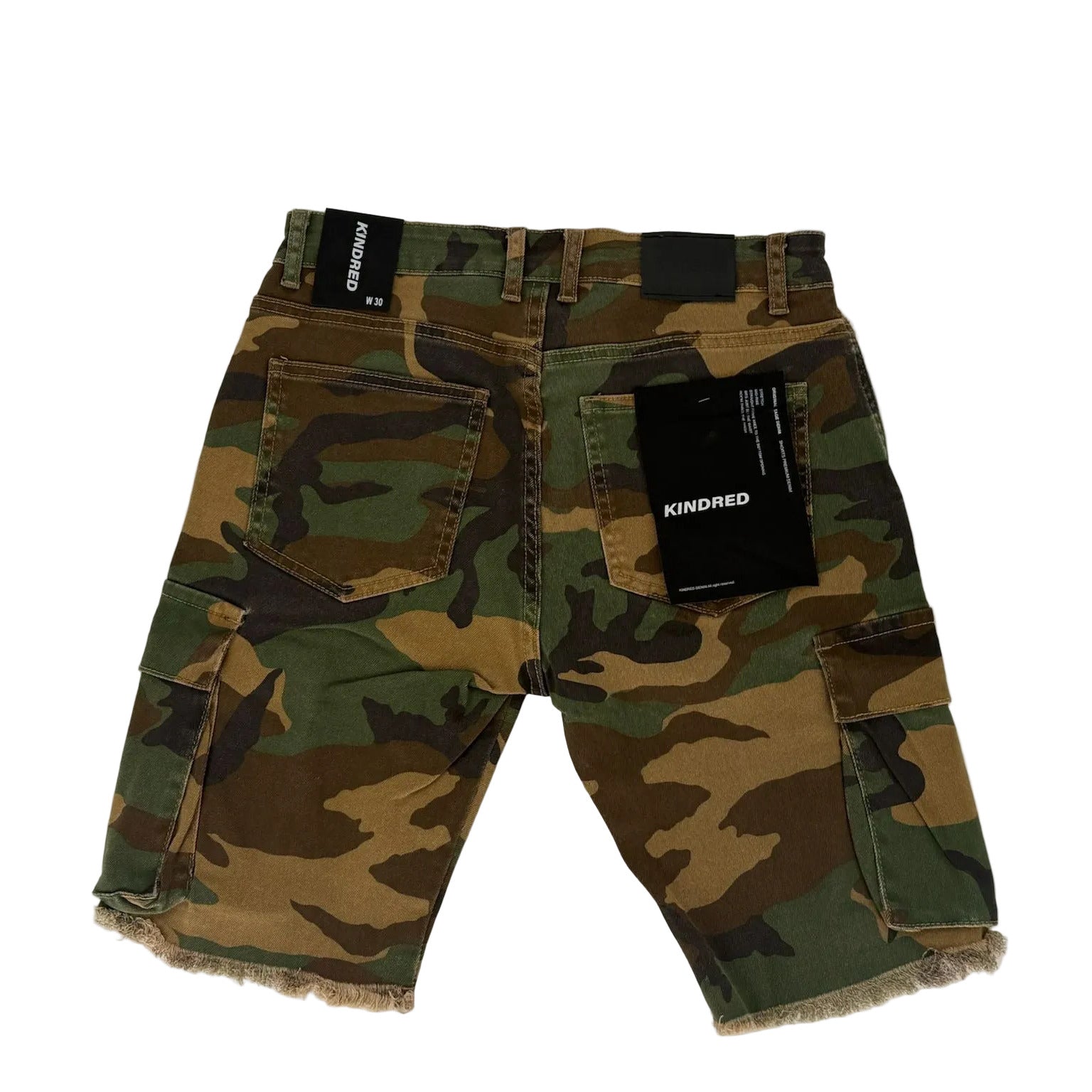 Camouflage pants with brand labels on a white background