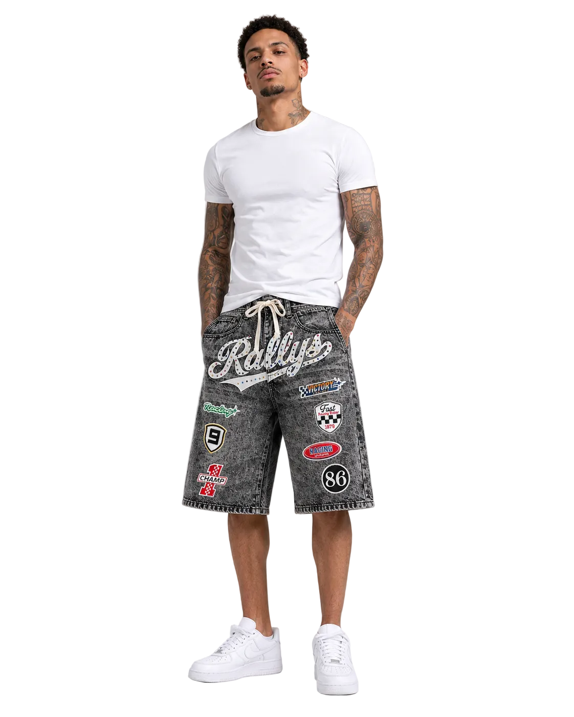 Kindred Patch Denim Shorts in black sand acid wash with racing patches and front script graphic