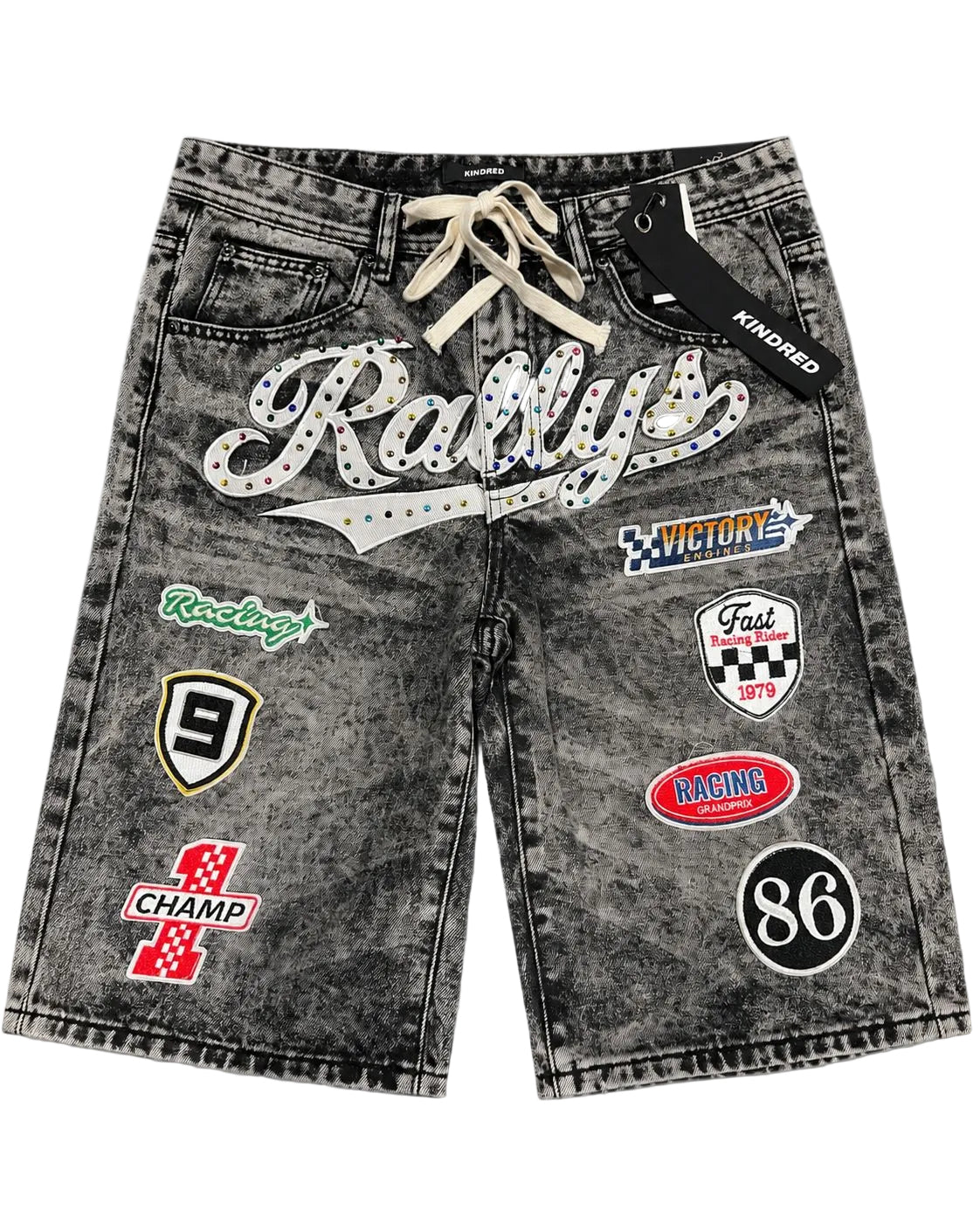 Kindred Patch Denim Shorts in black sand acid wash with racing patches and front script graphic