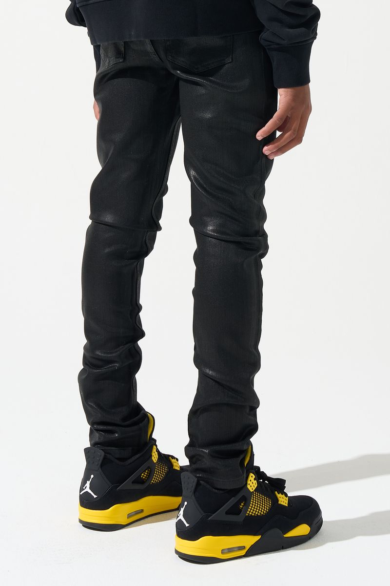 SERENEDE® Kids Onyx fitted black jeans with wax finish, five-pocket styling, and signature branded details.
