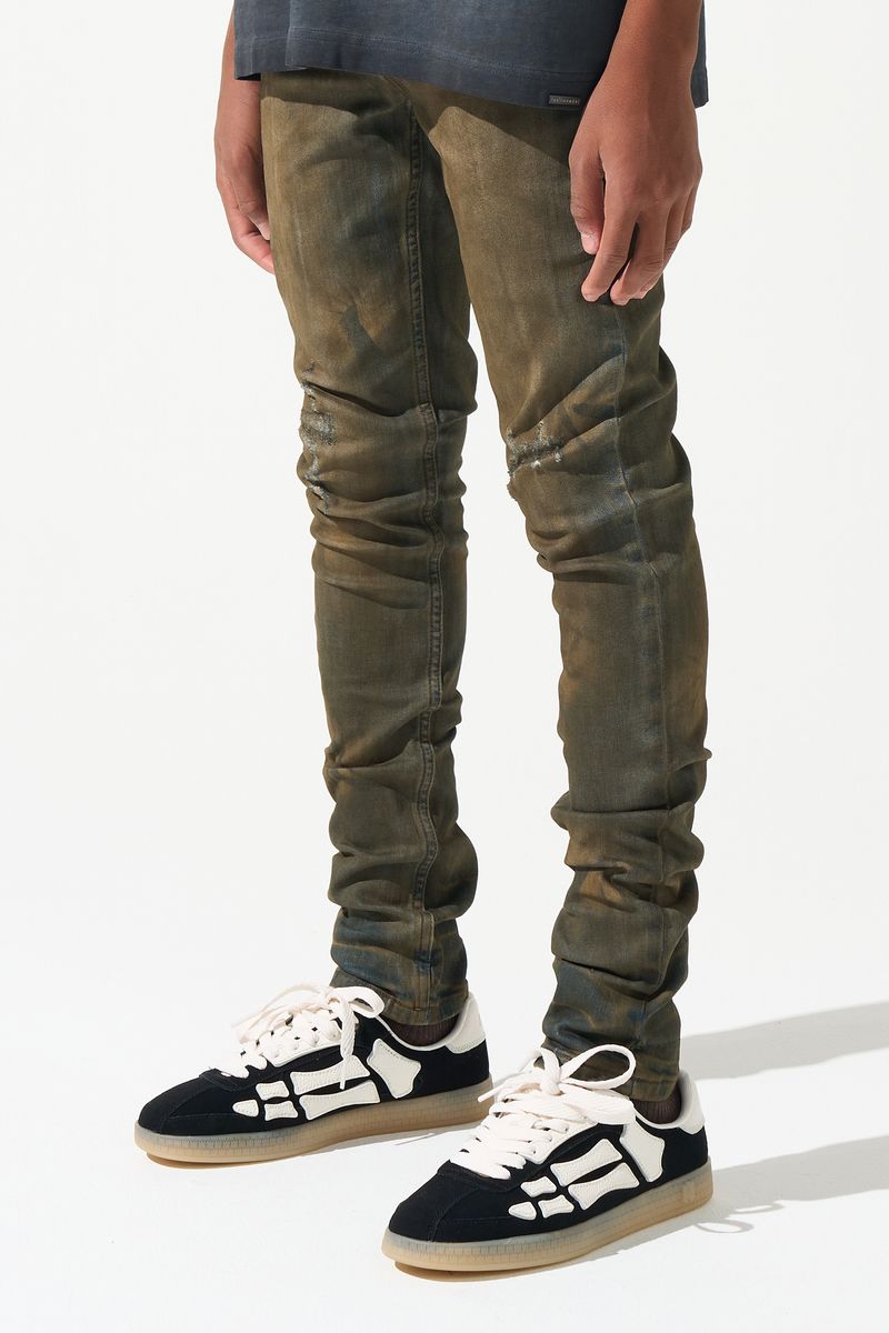 SERENEDE® Kids OUD fitted jeans in dark denim with brown overdye wash, knee distressing, and fading details.