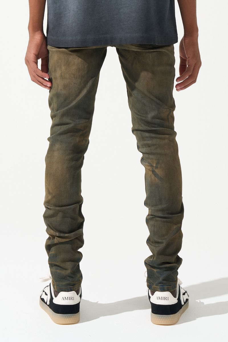 SERENEDE® Kids OUD fitted jeans in dark denim with brown overdye wash, knee distressing, and fading details.