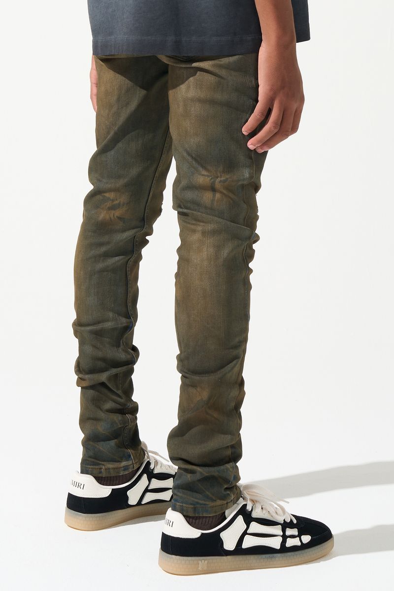 SERENEDE® Kids OUD fitted jeans in dark denim with brown overdye wash, knee distressing, and fading details.