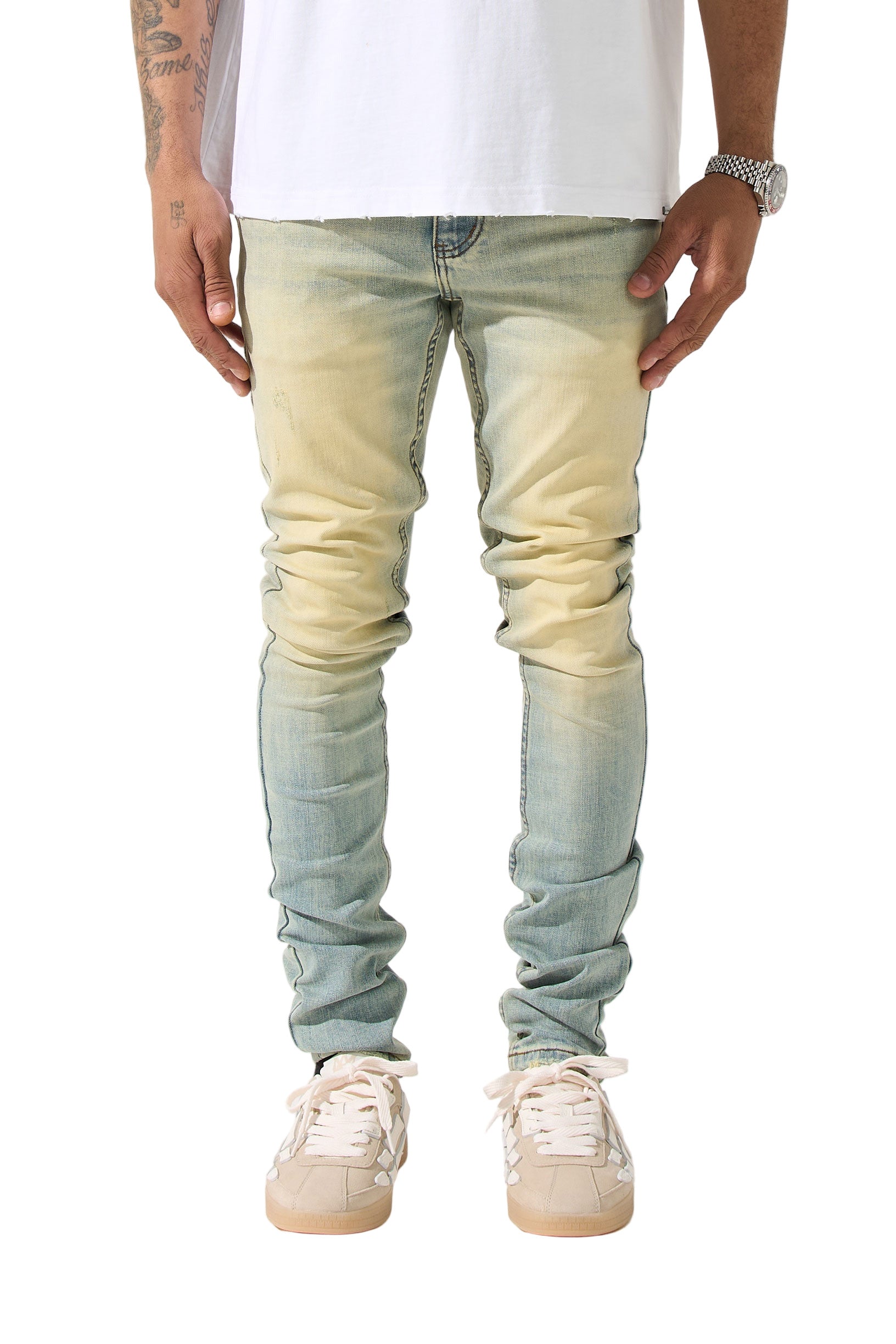 SERENEDE® LIMESTONE Jeans in vintage earth yellow with fitted construction, overdyed finish, fading, and embroidered [S]® logo.