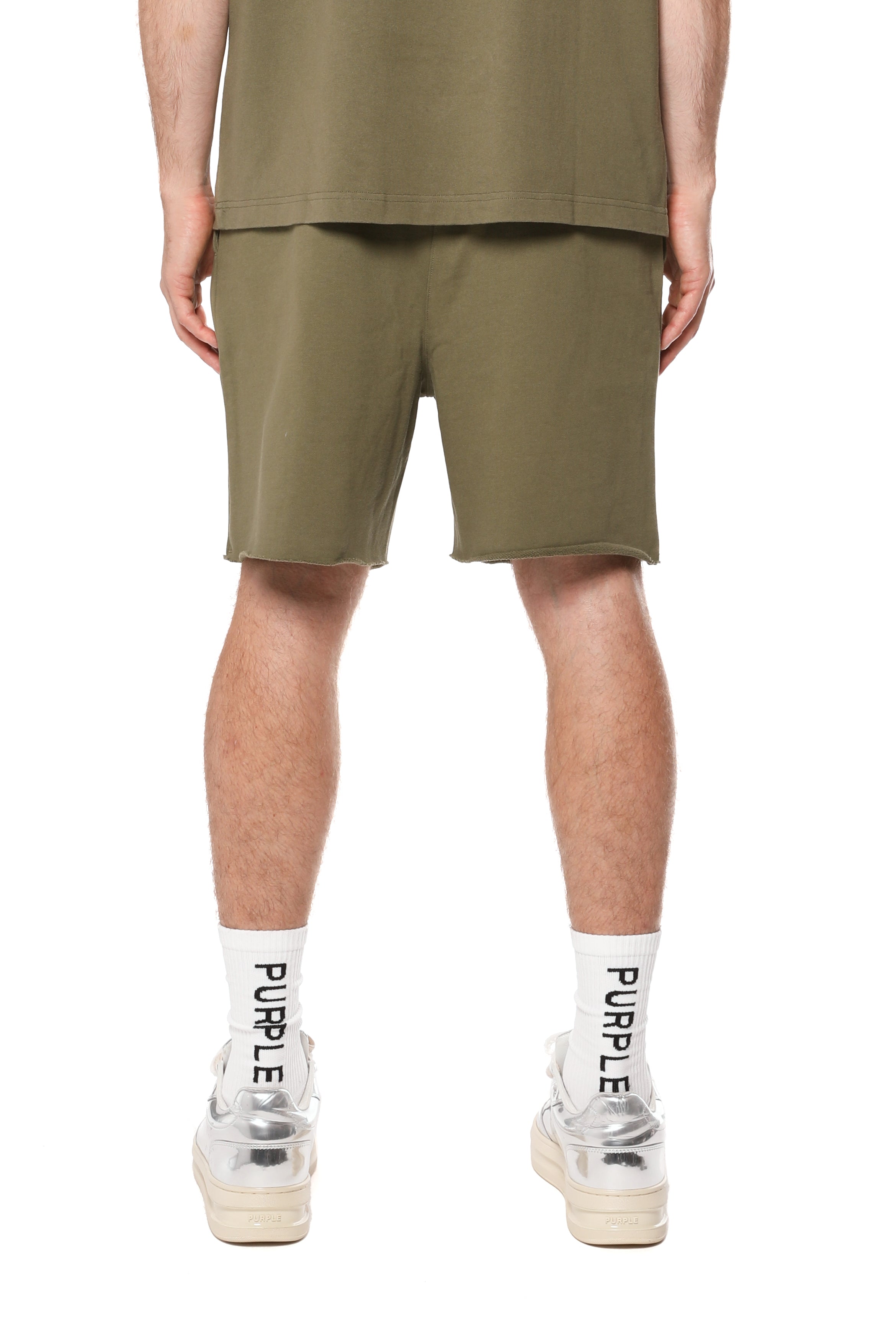 Purple Brand olive green French terry shorts made from heavyweight 100% cotton with a drawstring waistband, wordmark logo, rolled hems, and side pockets.