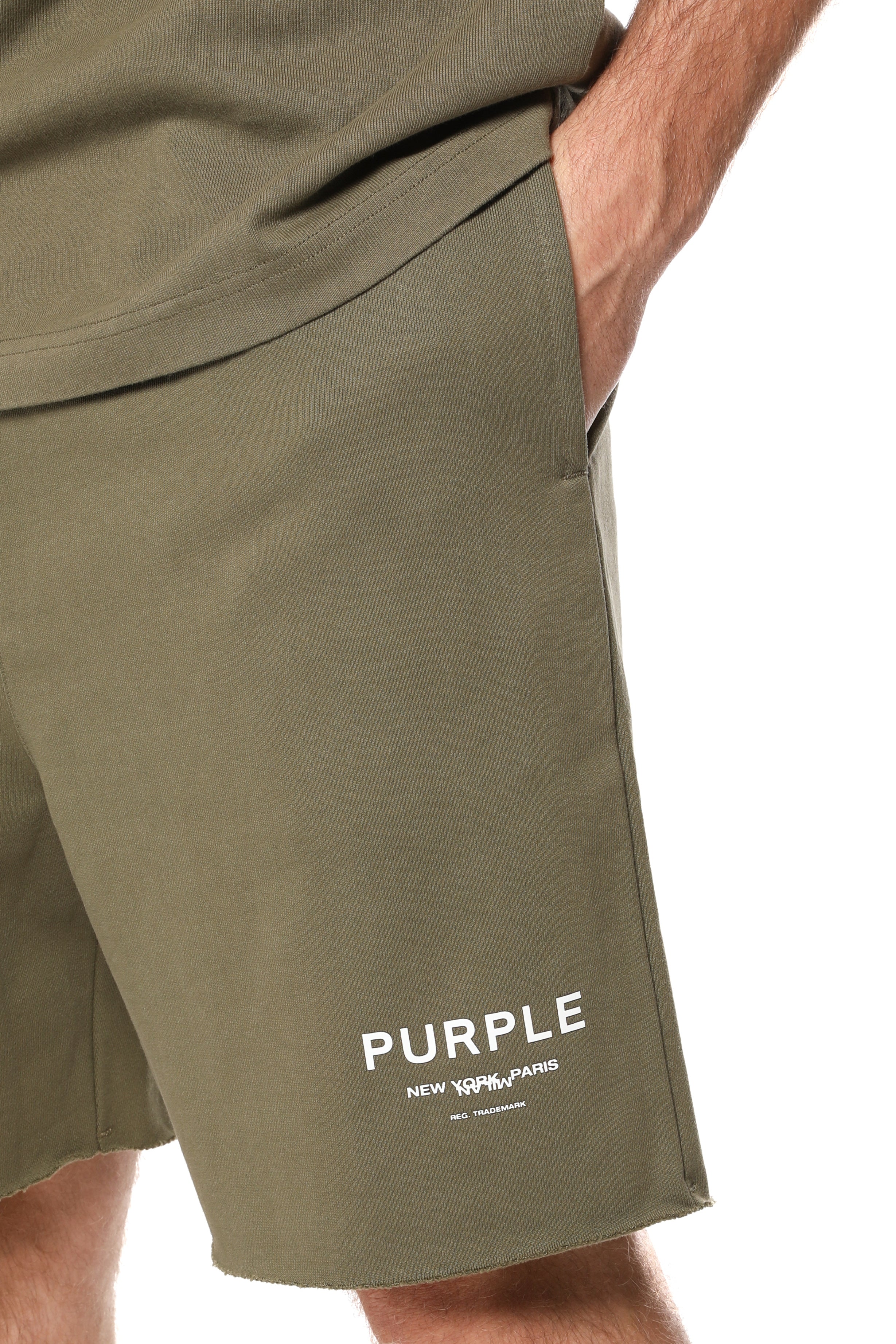 Purple Brand olive green French terry shorts made from heavyweight 100% cotton with a drawstring waistband, wordmark logo, rolled hems, and side pockets.