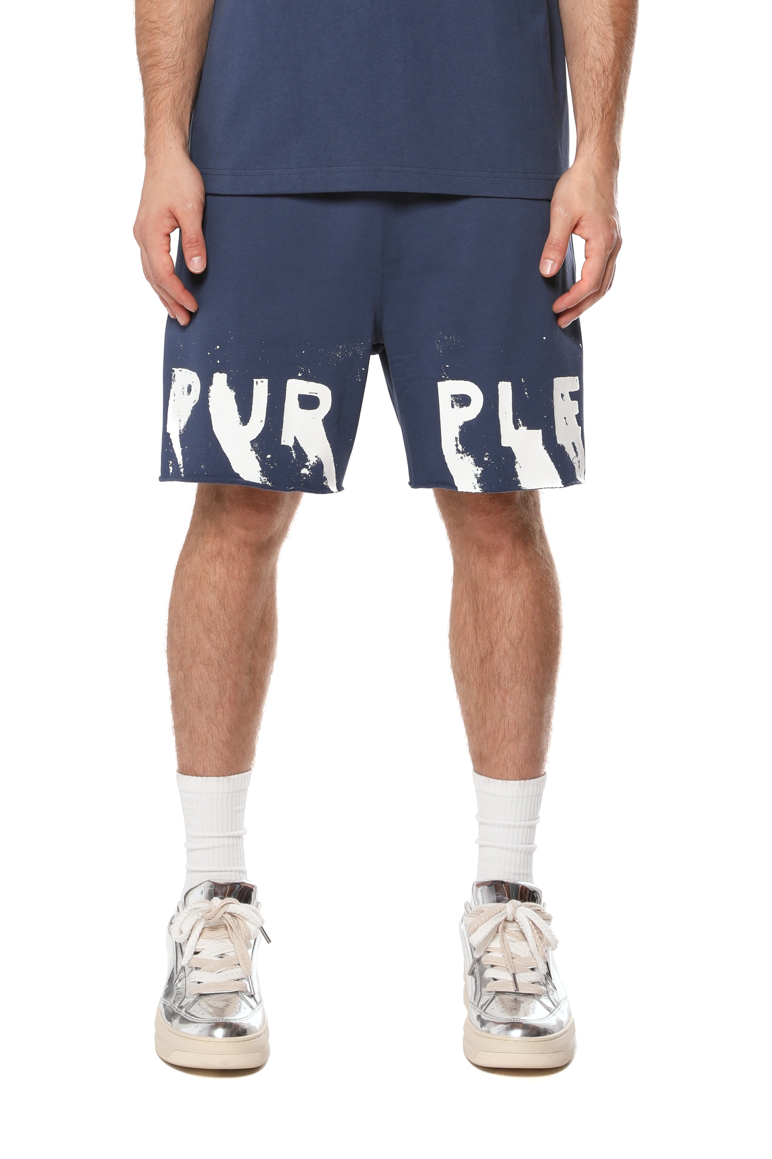 Purple Brand cotton sweat shorts featuring logo lettering on the front legs, a drawstring waistband, raw-edge hem, and two hand pockets.