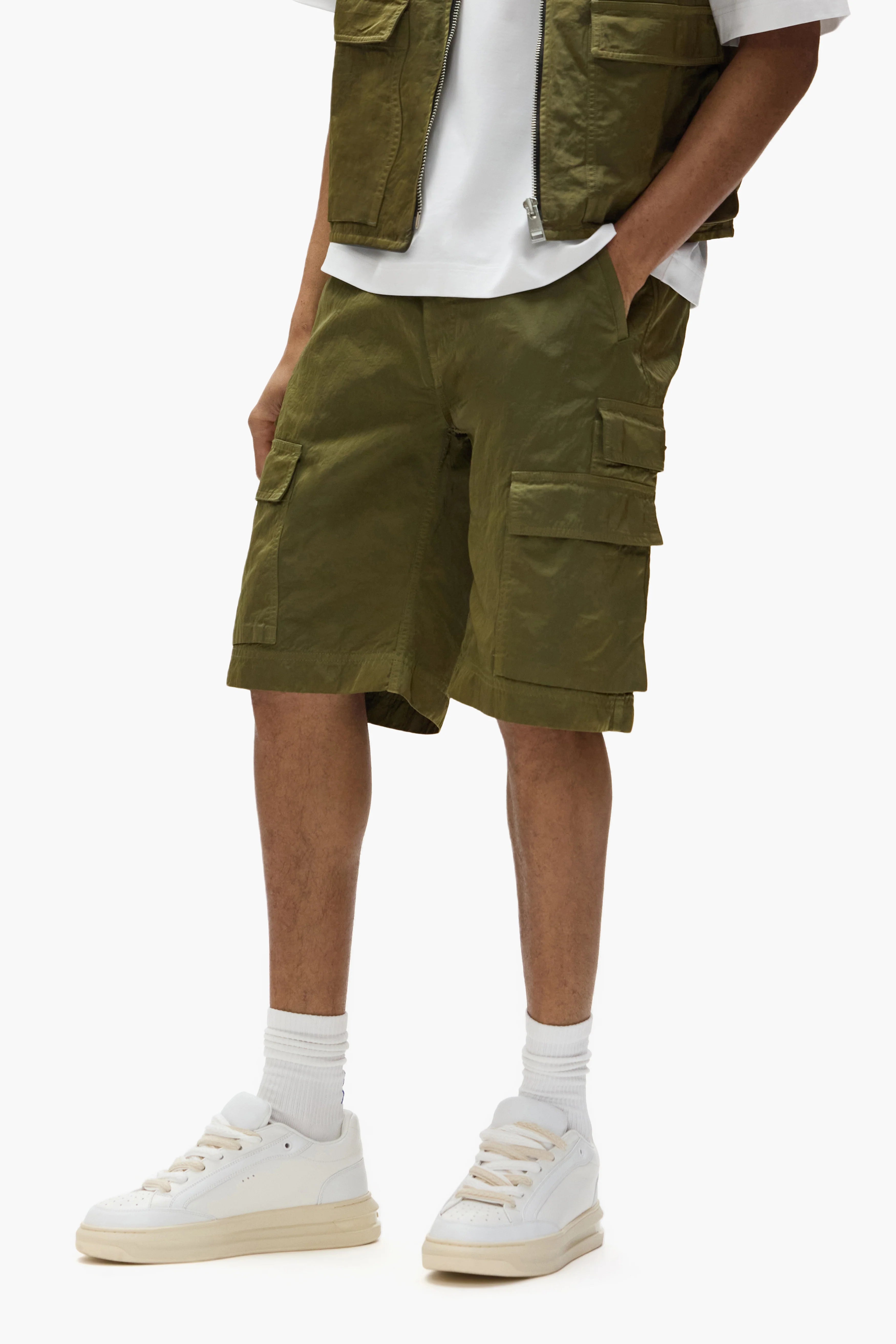 Purple Brand green sateen cargo shorts with utility pockets and relaxed fit laid flat