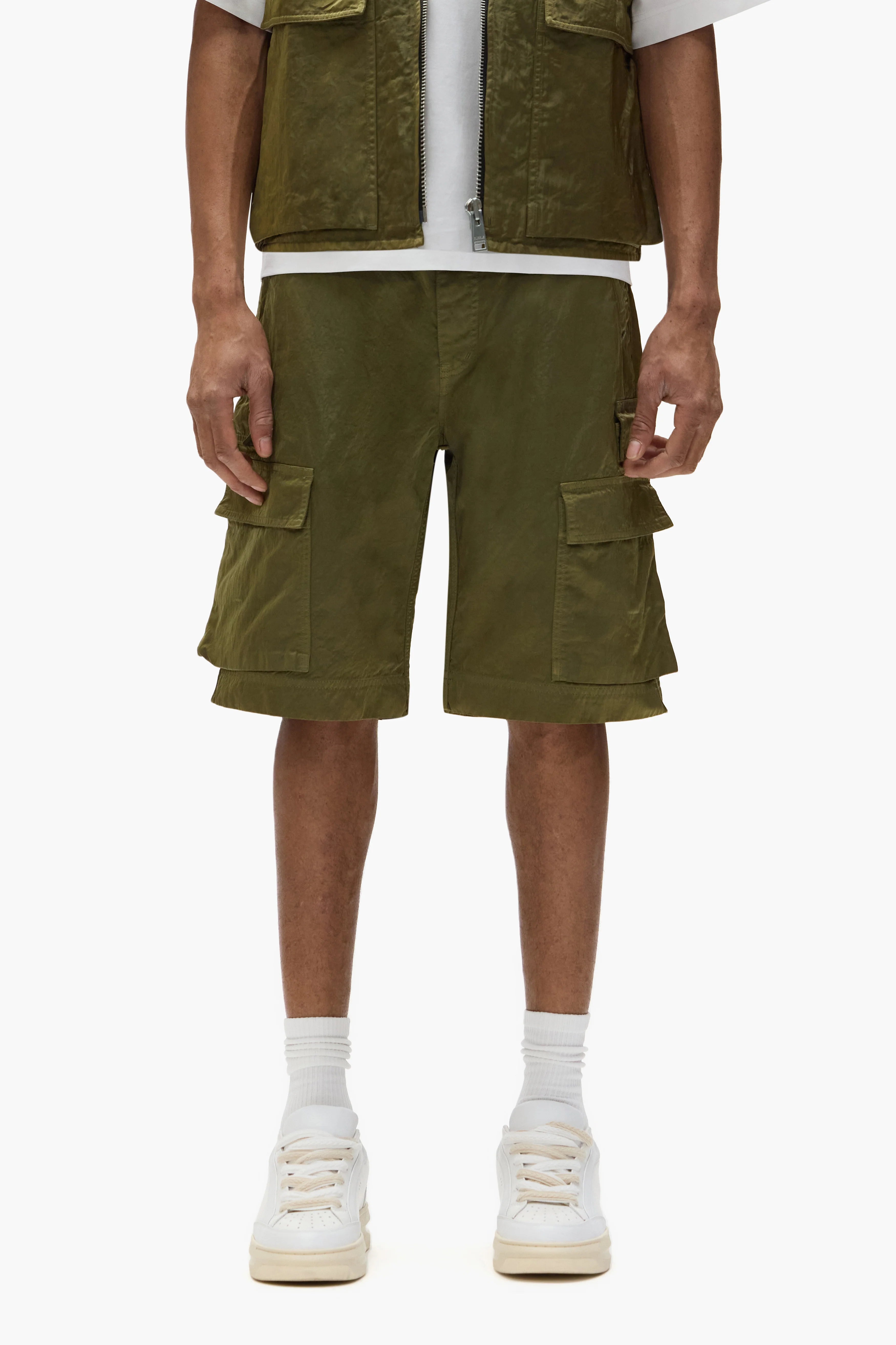 Purple Brand green sateen cargo shorts with utility pockets and relaxed fit laid flat