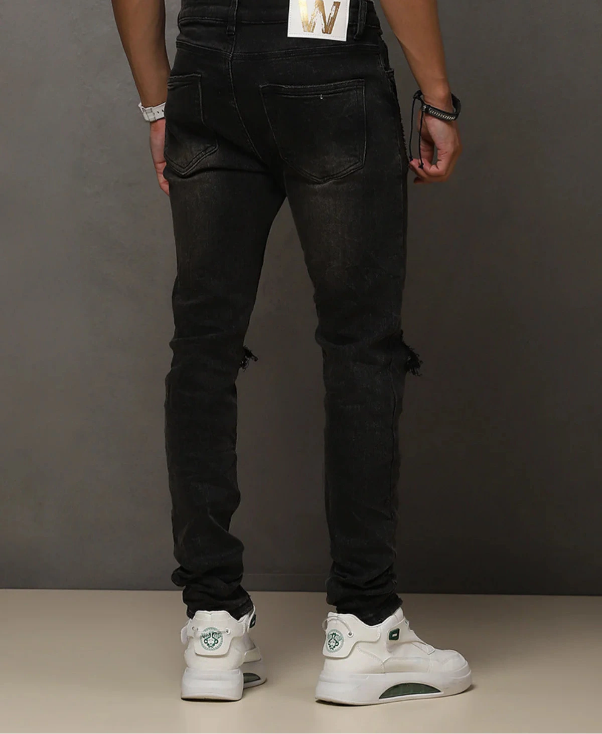 “W by Waimea Men’s Skinny Jeans: trendy blow-out knee design in stretchy woven denim (95% cotton, 3% rayon, 2% spandex). Sleek, stylish, and durable.”