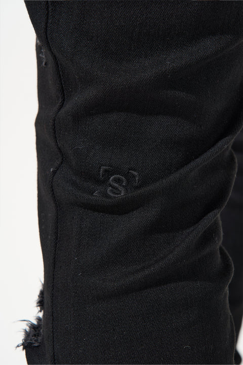  SERENEDE® Midnight Black skinny jeans in jet-black wash with high-stretch material, distressing, and branded hardware.