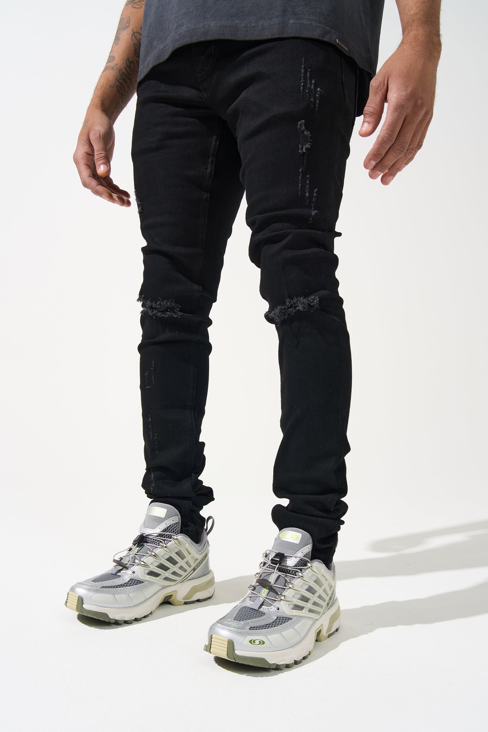 SERENEDE® Midnight Black skinny jeans in jet-black wash with high-stretch material, distressing, and branded hardware.