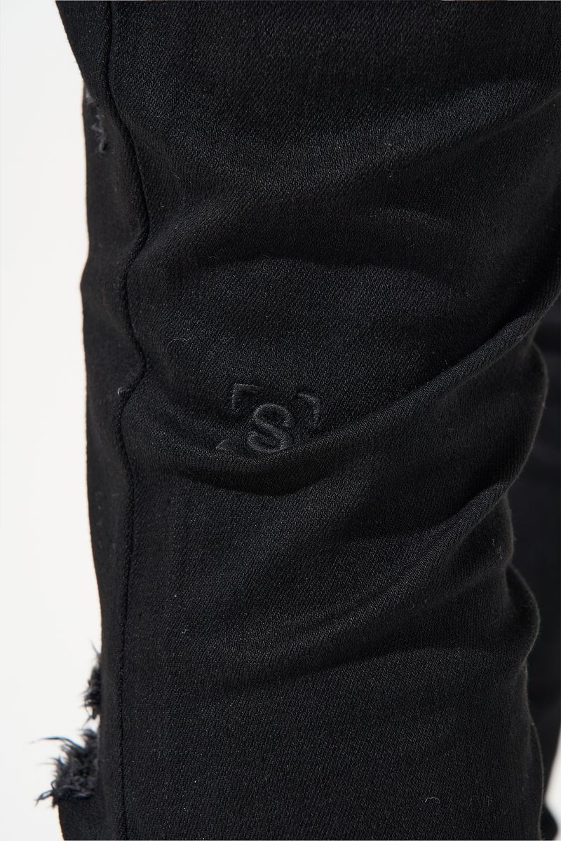 SERENEDE® Midnight Black skinny jeans in jet-black wash with distressed detailing and signature leather waistband patch.