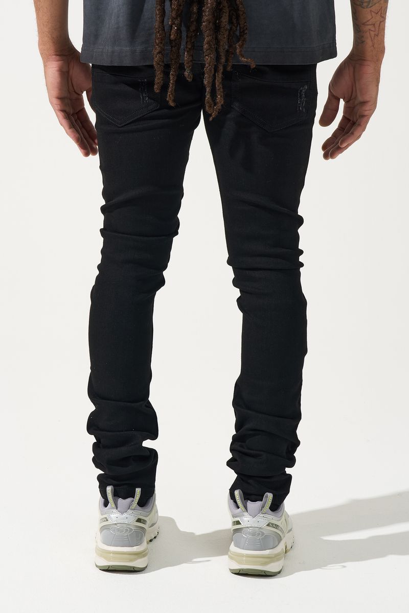 SERENEDE® Midnight Black skinny jeans in jet-black wash with distressed detailing and signature leather waistband patch.