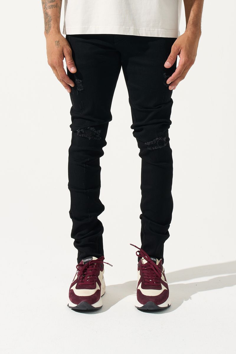 SERENEDE® Midnight Black skinny jeans in jet-black wash with distressed detailing and signature leather waistband patch.