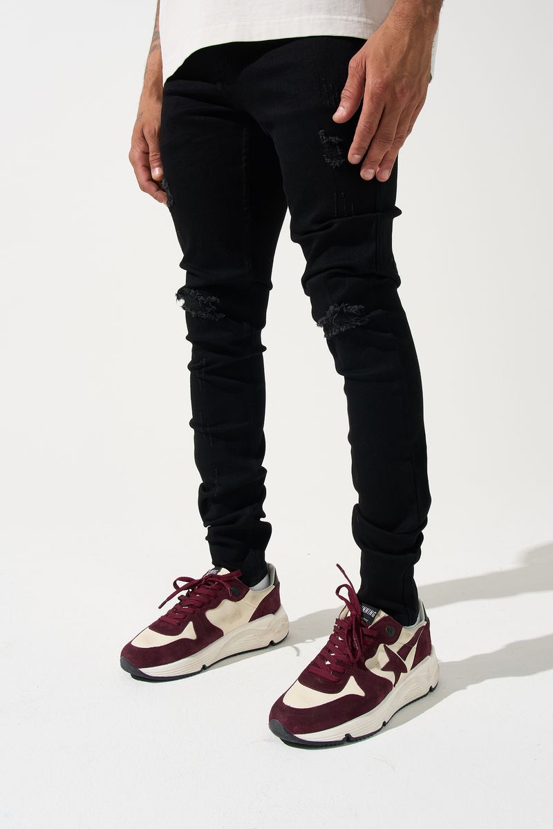 SERENEDE® Midnight Black skinny jeans in jet-black wash with distressed detailing and signature leather waistband patch.