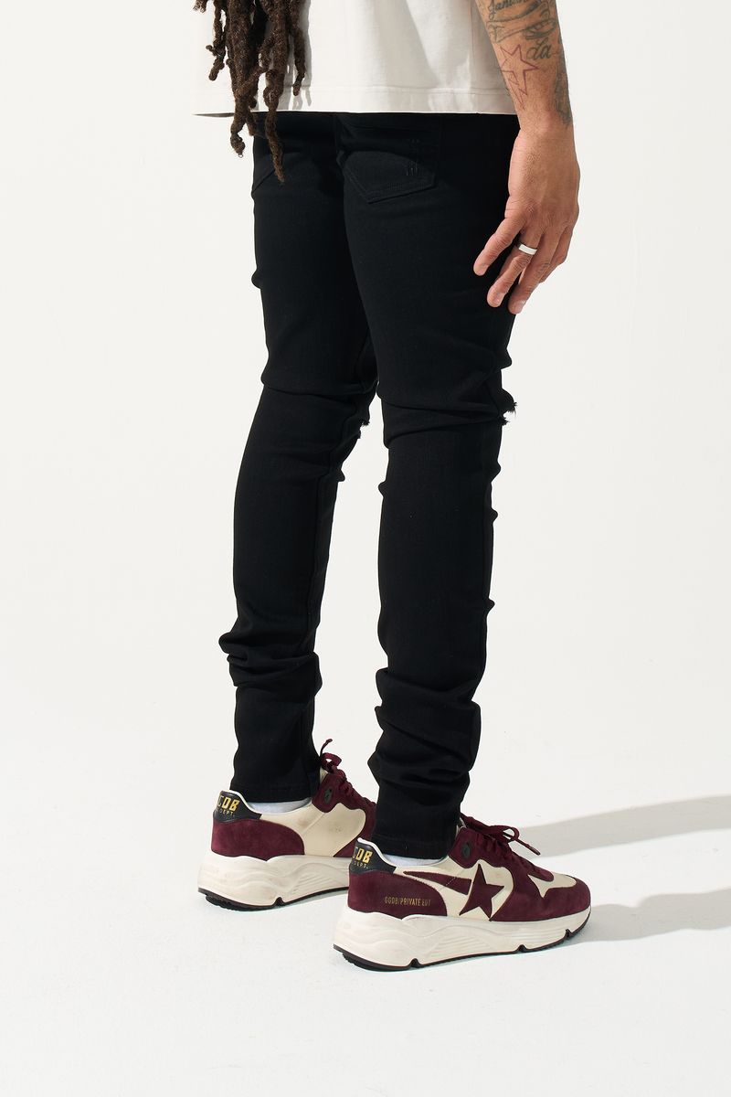 SERENEDE® Midnight Black skinny jeans in jet-black wash with distressed detailing and signature leather waistband patch.