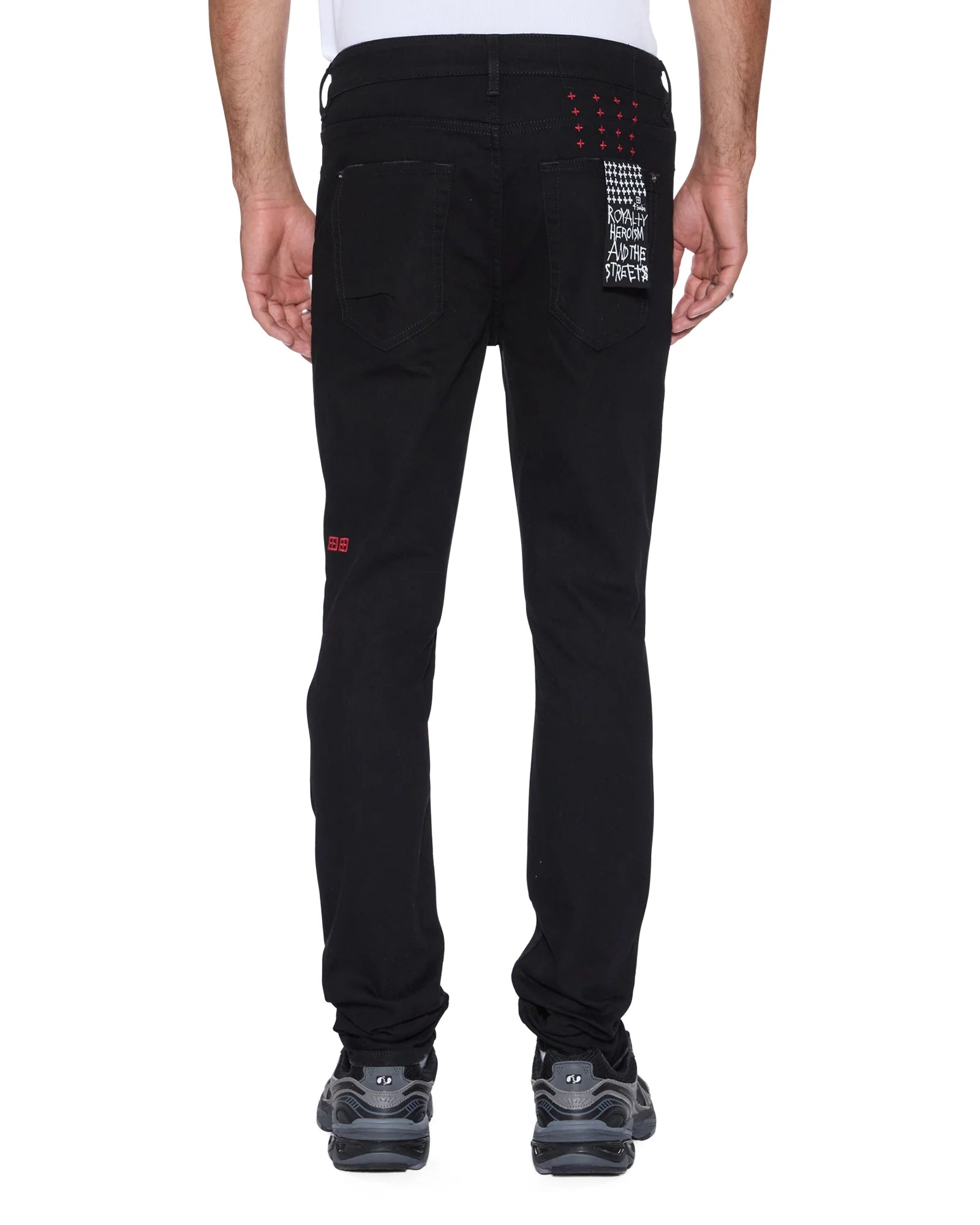 Van Winkle Laid Black Sting skinny jeans in black denim with knee deconstruction, seasonal printed art, and Ksubi signature embroidery