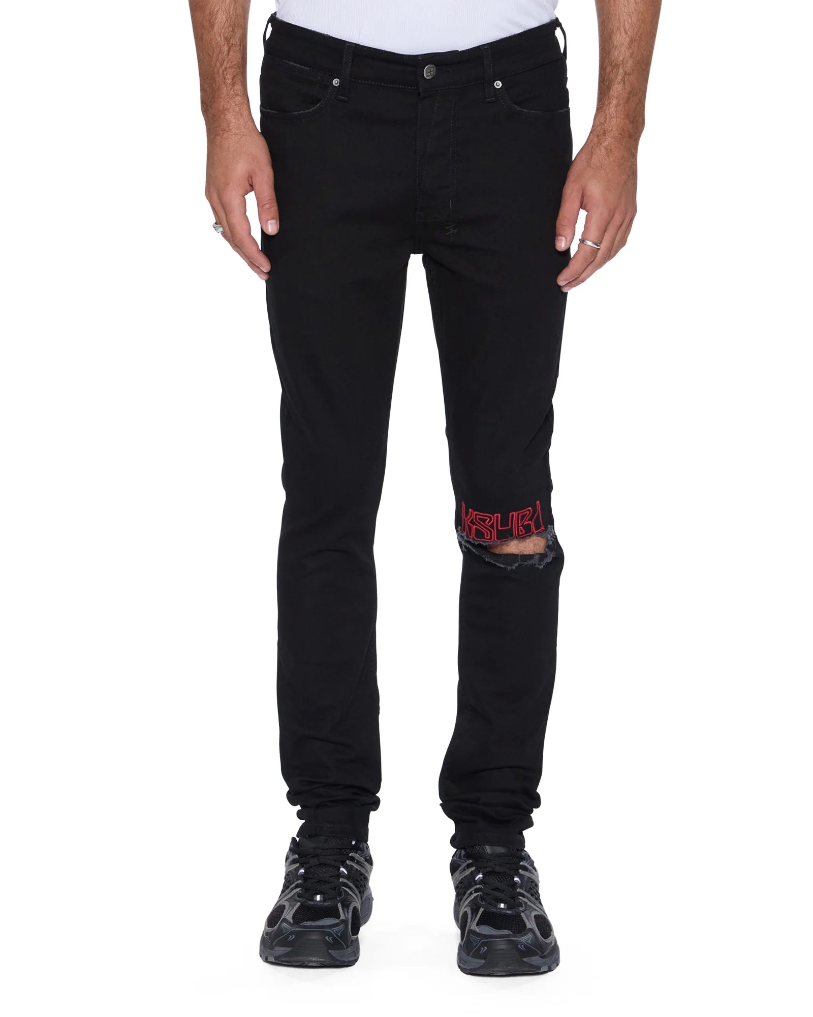 Van Winkle Laid Black Sting skinny jeans in black denim with knee deconstruction, seasonal printed art, and Ksubi signature embroidery