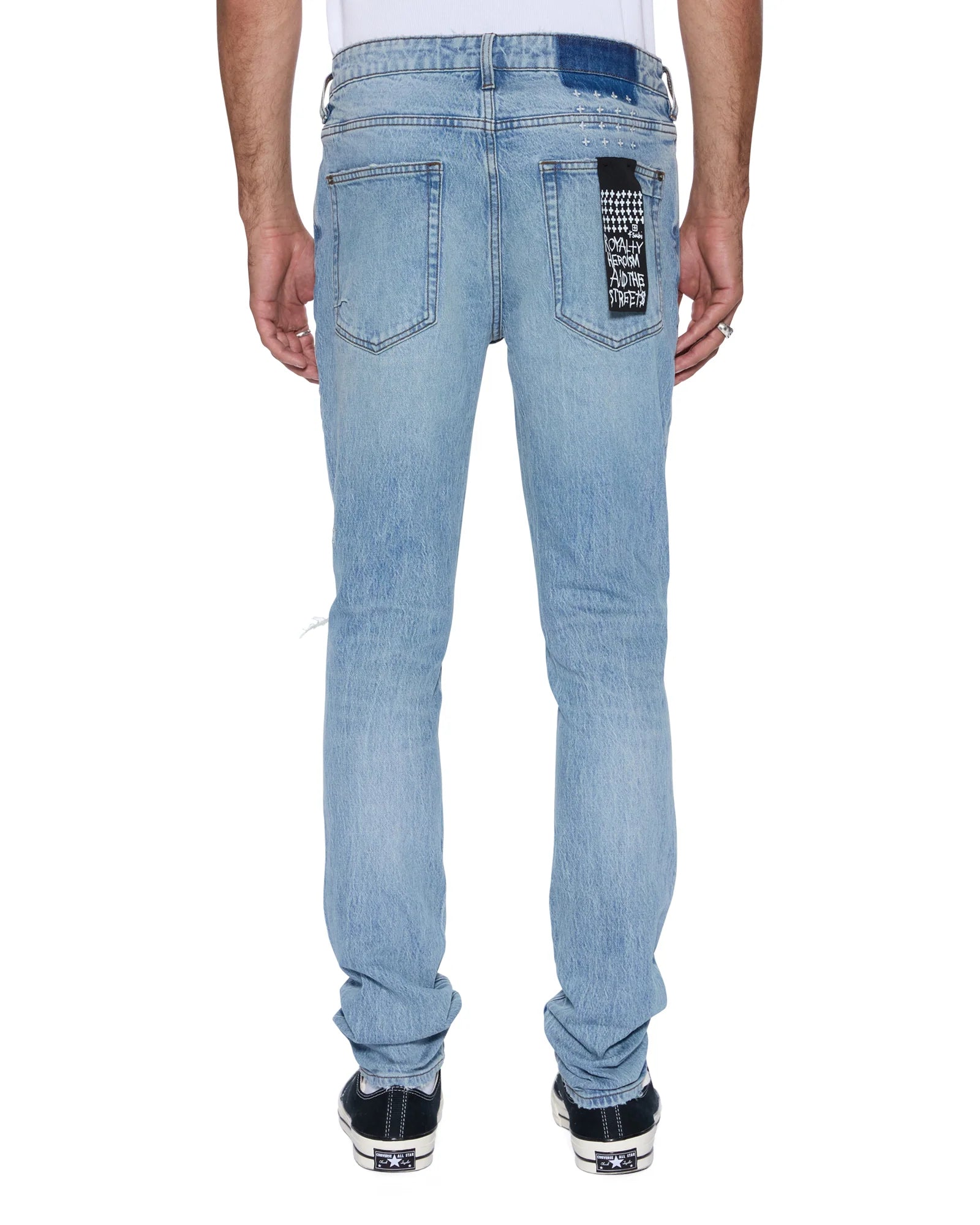 Van Winkle Painter 1999 mid-rise skinny jeans with medium stone wash, boucle knee patch, and Ksubi signature embroidery