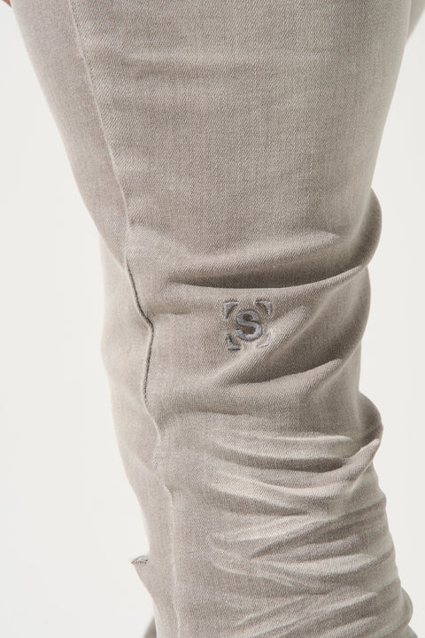 SERENEDE Marine Layer Jeans in cool grey wash with minimal knee distressing and skinny fit.
